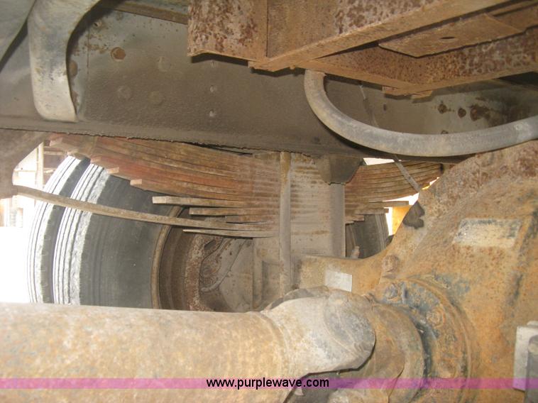 image for item J2755 1989 Ford F700F flatbed truck with crane