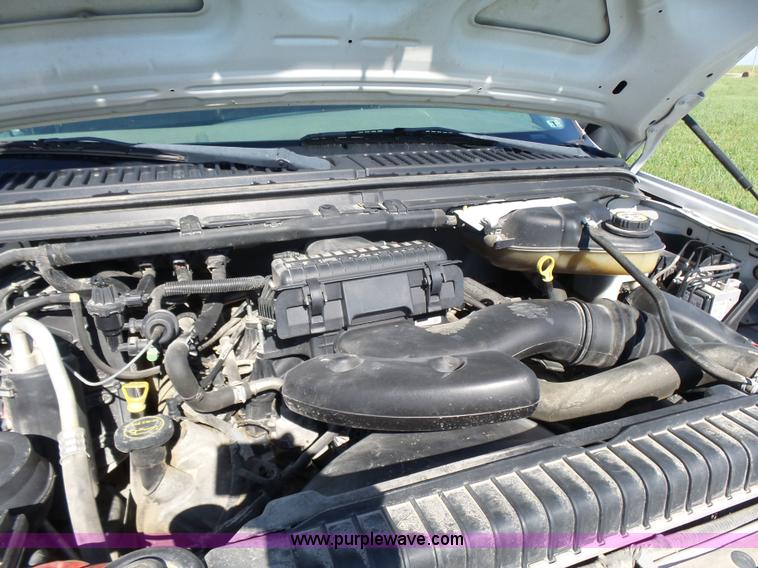 image for item K3154 2006 Ford F250 Super Duty SuperCab flatbed pickup truck