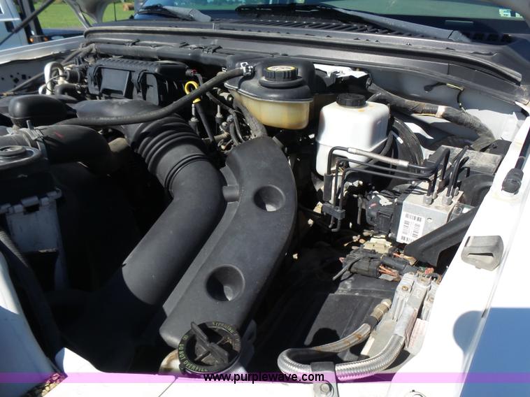 image for item K3154 2006 Ford F250 Super Duty SuperCab flatbed pickup truck