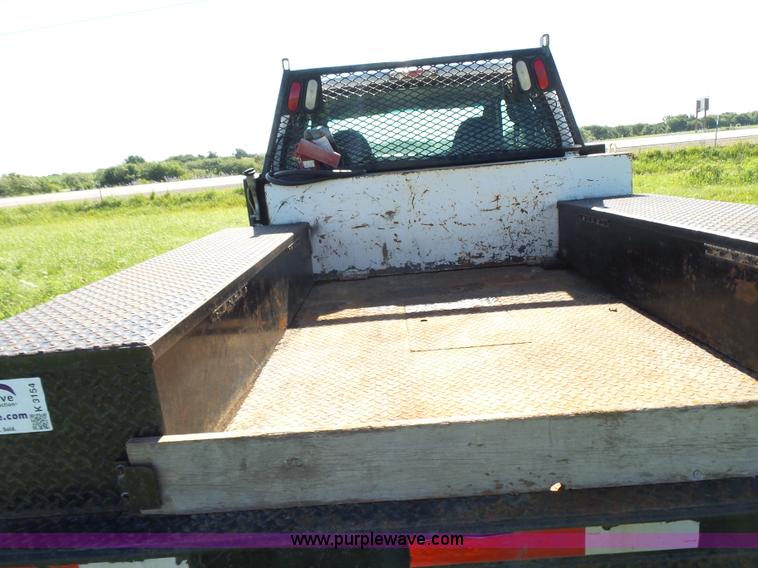 image for item K3154 2006 Ford F250 Super Duty SuperCab flatbed pickup truck