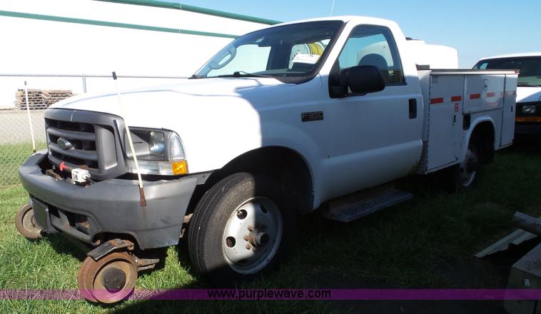 image for item K8242 2004 Ford F350 Super Duty XL utility truck with Hi-Rail/Road rail