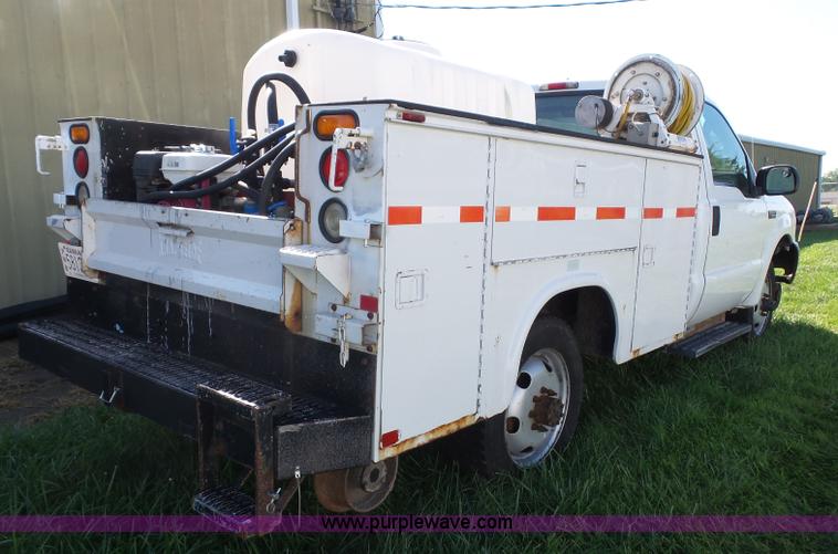 image for item K8242 2004 Ford F350 Super Duty XL utility truck with Hi-Rail/Road rail