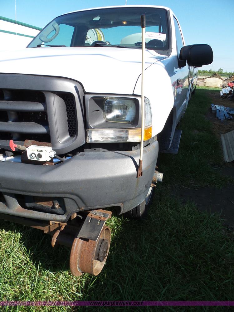 image for item K8242 2004 Ford F350 Super Duty XL utility truck with Hi-Rail/Road rail