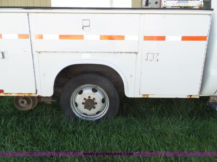 image for item K8242 2004 Ford F350 Super Duty XL utility truck with Hi-Rail/Road rail