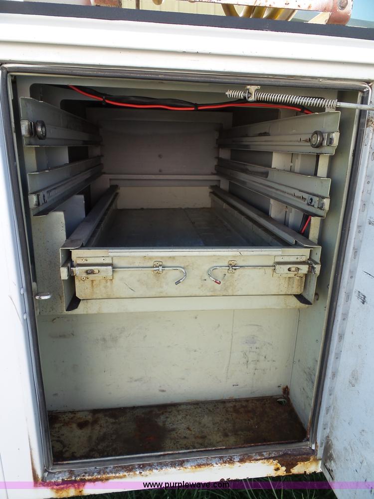 image for item K8242 2004 Ford F350 Super Duty XL utility truck with Hi-Rail/Road rail