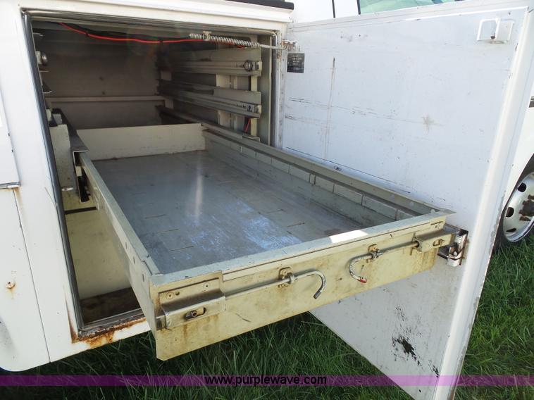 image for item K8242 2004 Ford F350 Super Duty XL utility truck with Hi-Rail/Road rail