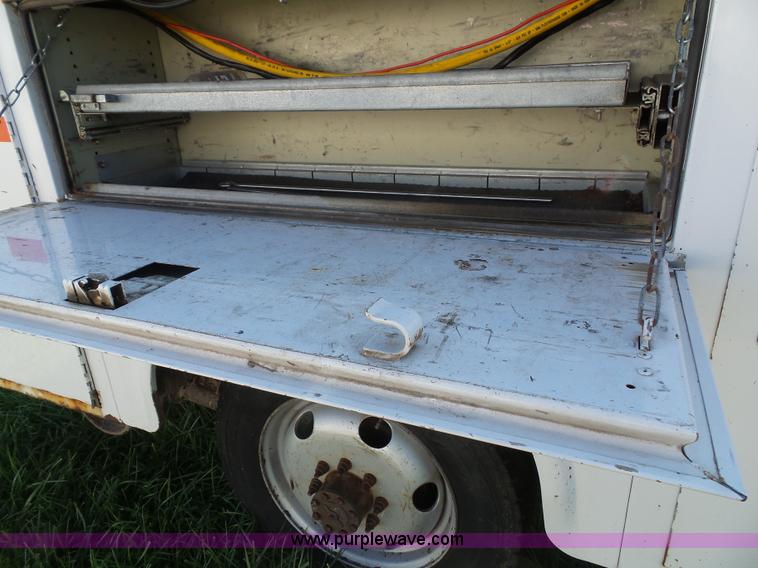 image for item K8242 2004 Ford F350 Super Duty XL utility truck with Hi-Rail/Road rail