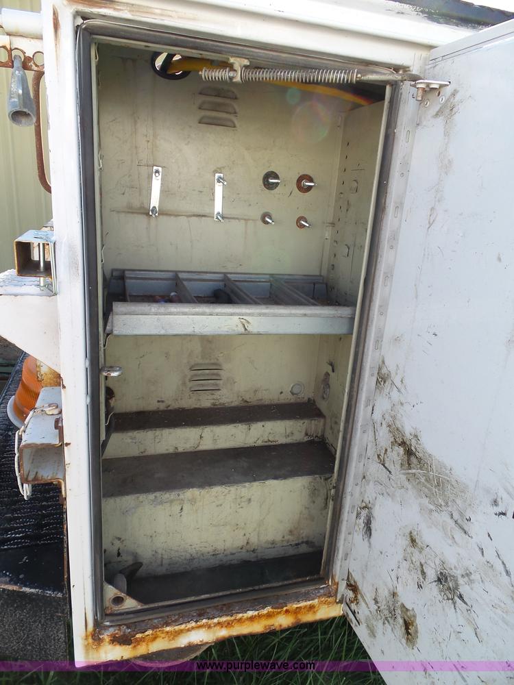 image for item K8242 2004 Ford F350 Super Duty XL utility truck with Hi-Rail/Road rail