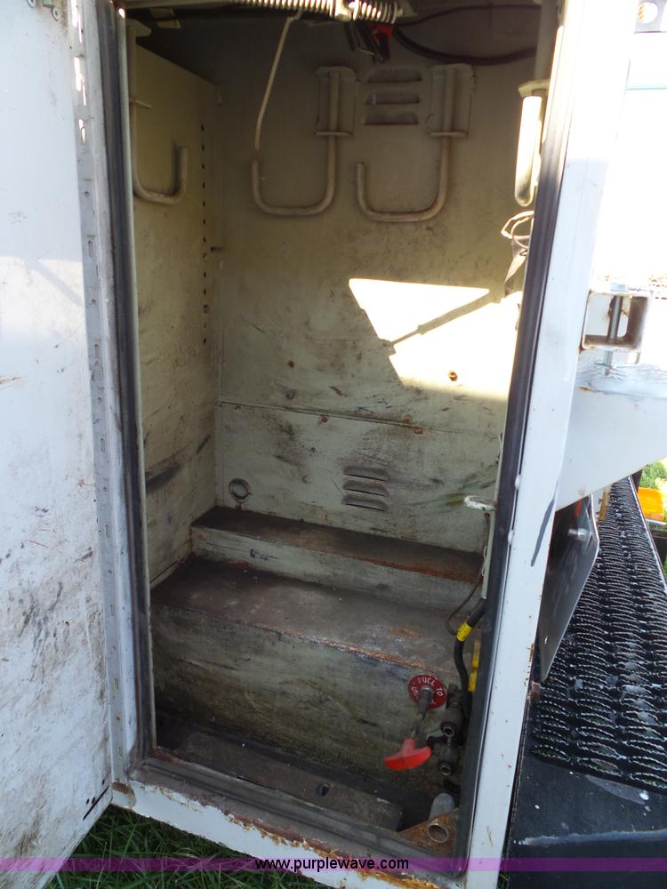 image for item K8242 2004 Ford F350 Super Duty XL utility truck with Hi-Rail/Road rail