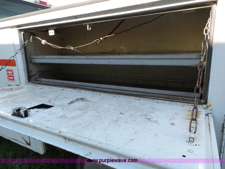 image for item K8242 2004 Ford F350 Super Duty XL utility truck with Hi-Rail/Road rail