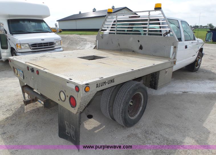 image for item K8476 1999 Chevrolet 3500 LS Crew Cab flatbed pickup truck