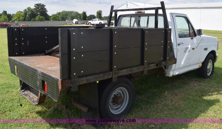image for item L2558 1994 Ford F250 HD flatbed pickup truck