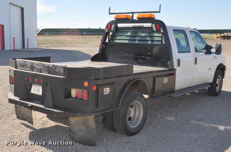 image for item G7484 2005 Ford F350 Super Duty Crew Cab flatbed pickup truck