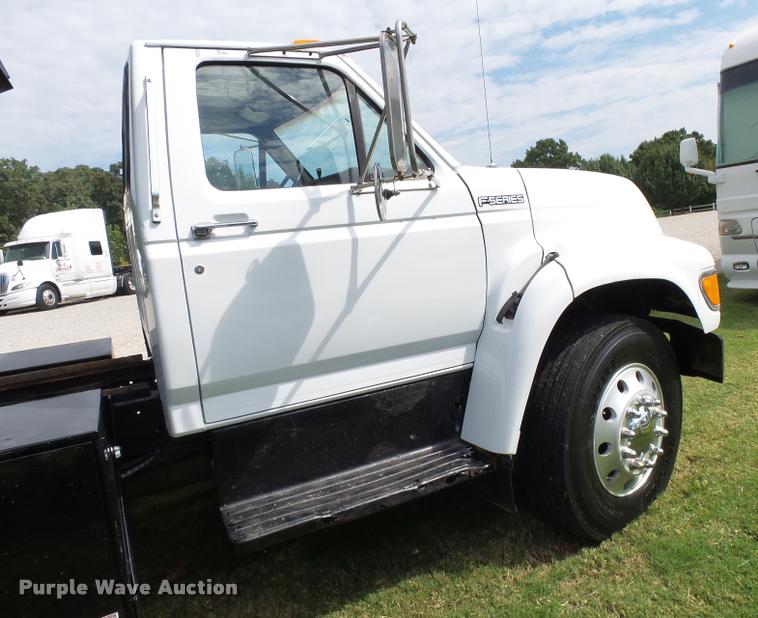 image for item K1128 1999 Ford F800 dump flatbed truck