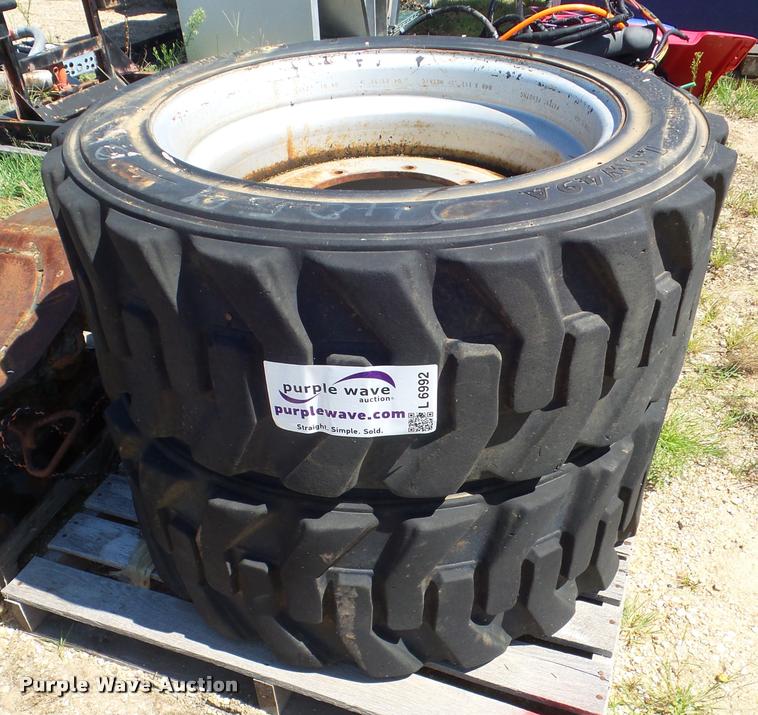 image for item L6992 (2) Titan 385-648 solid filled skid steer tires
