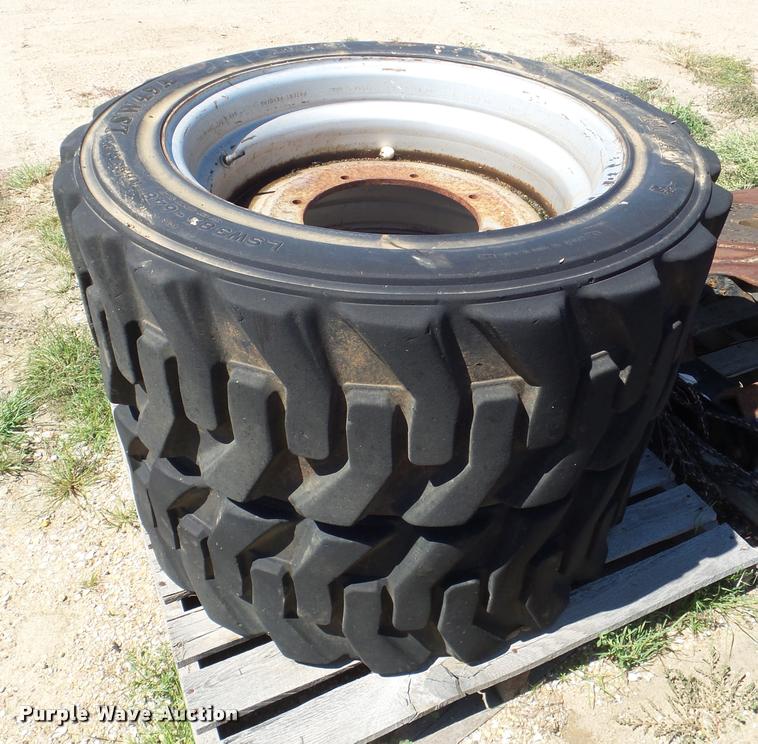 image for item L6992 (2) Titan 385-648 solid filled skid steer tires