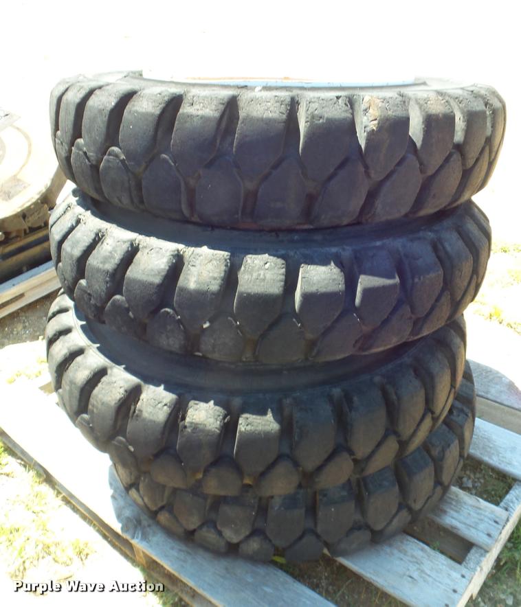 image for item L6993 (8) 8.25-20 tires and wheels