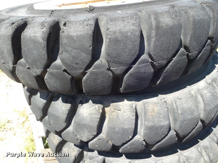 image for item L6993 (8) 8.25-20 tires and wheels