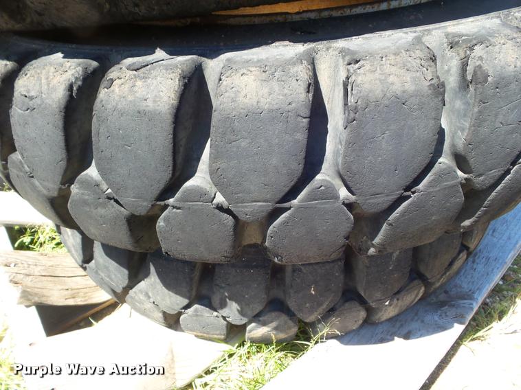 image for item L6993 (8) 8.25-20 tires and wheels