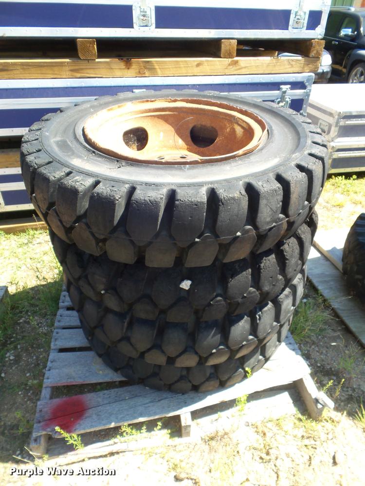 image for item L6993 (8) 8.25-20 tires and wheels