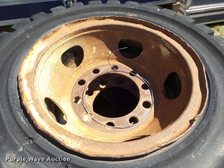 image for item L6993 (8) 8.25-20 tires and wheels