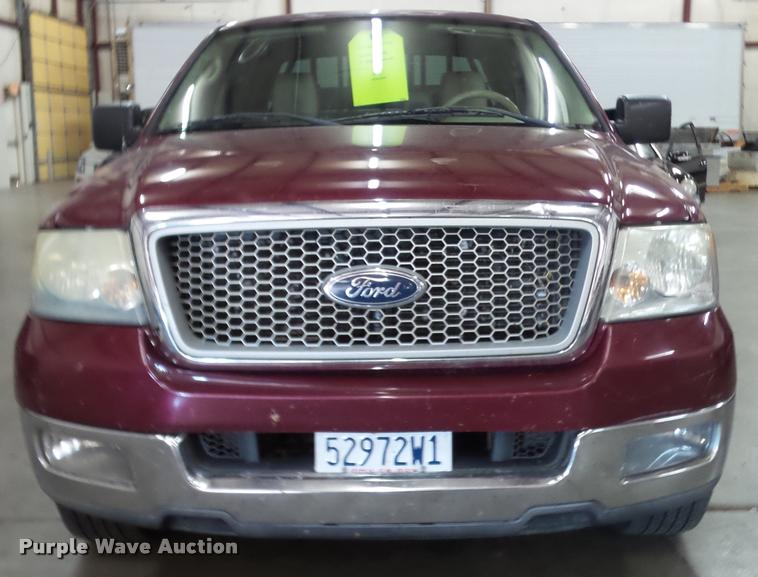 image for item K8183 2004 Ford F150 Lariat SuperCrew flatbed pickup truck