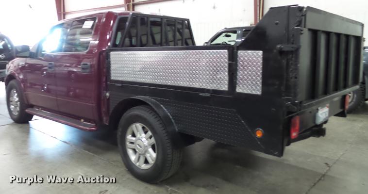 image for item K8183 2004 Ford F150 Lariat SuperCrew flatbed pickup truck