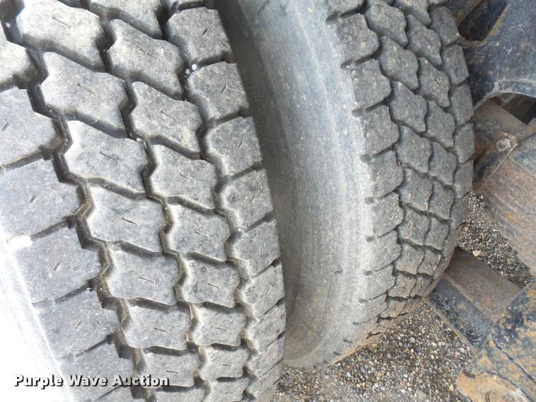 image for item K3670 1999 Sterling L9000 flatbed truck with crane