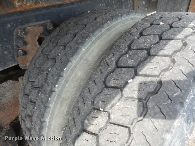 image for item K3670 1999 Sterling L9000 flatbed truck with crane