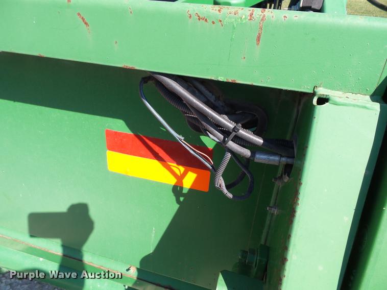 image for item J4763 2004 John Deere 630F Hydra flex head