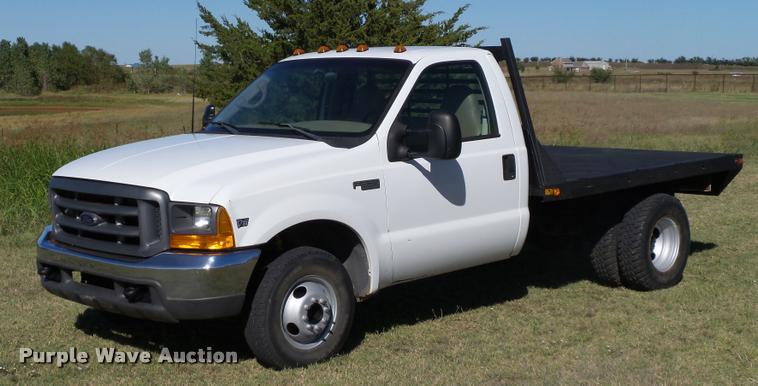 image for item DB4557 1999 Ford F350 Super Duty flatbed pickup truck