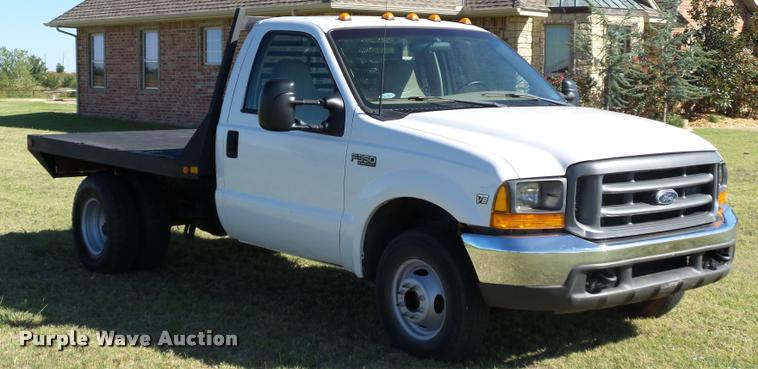 image for item DB4557 1999 Ford F350 Super Duty flatbed pickup truck