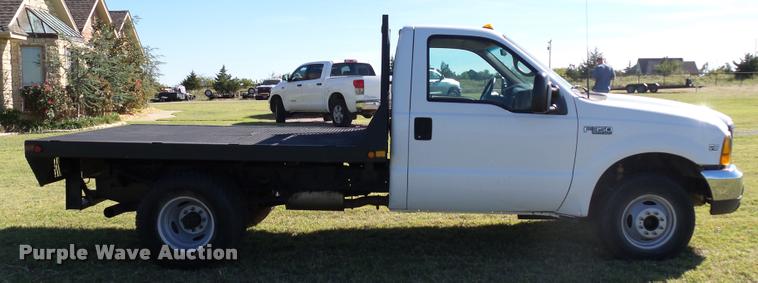 image for item DB4557 1999 Ford F350 Super Duty flatbed pickup truck