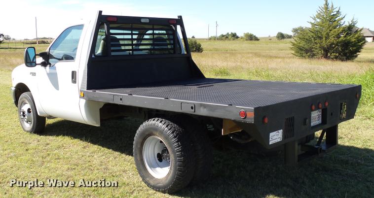 image for item DB4557 1999 Ford F350 Super Duty flatbed pickup truck