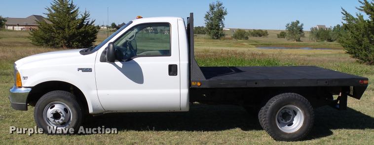 image for item DB4557 1999 Ford F350 Super Duty flatbed pickup truck