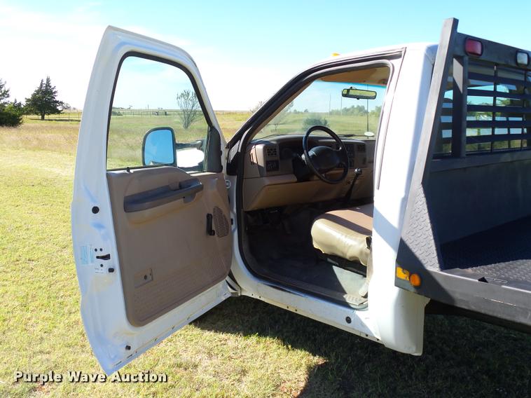 image for item DB4557 1999 Ford F350 Super Duty flatbed pickup truck