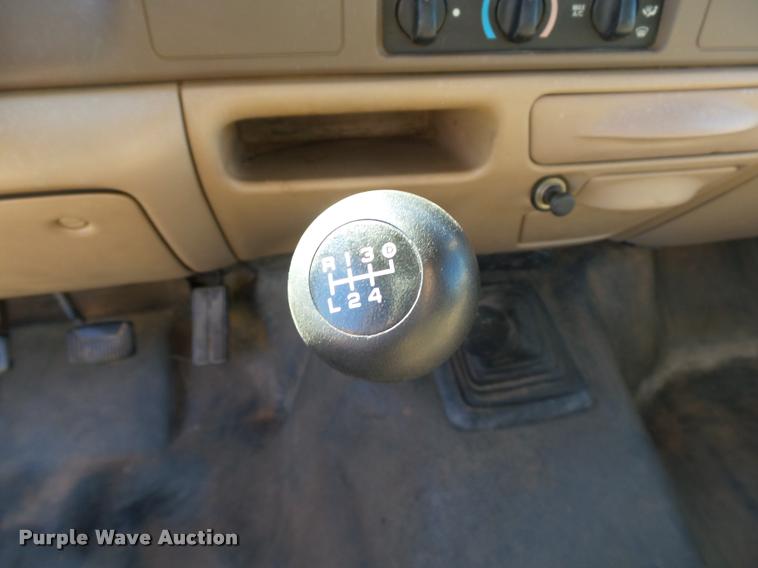 image for item DB4557 1999 Ford F350 Super Duty flatbed pickup truck