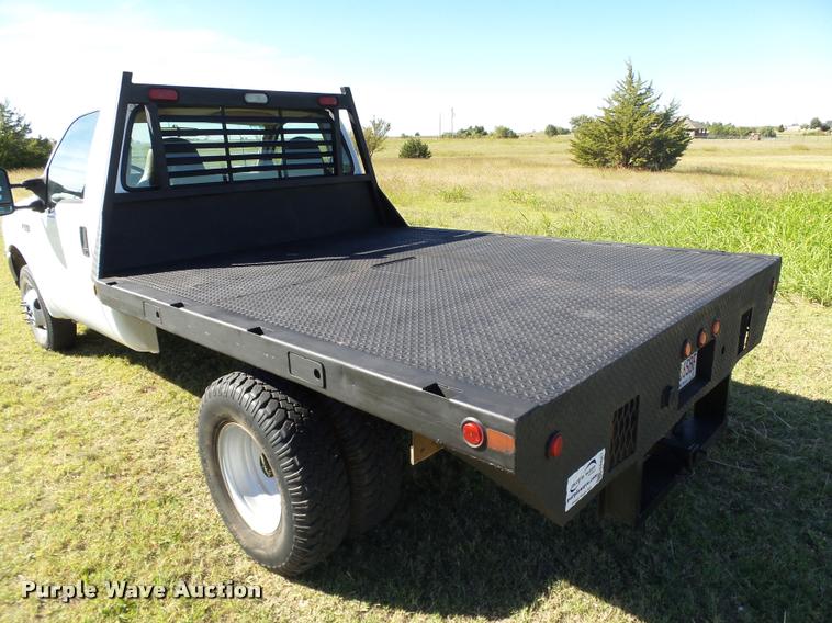 image for item DB4557 1999 Ford F350 Super Duty flatbed pickup truck