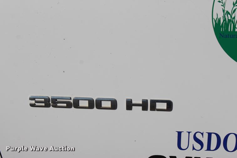 image for item L4828 2012 Chevrolet Silverado 3500HD Crew Cab flatbed pickup truck