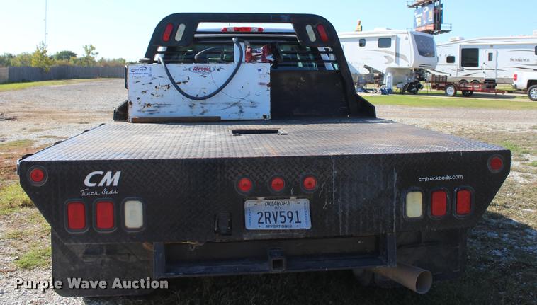 image for item L4829 2011 Chevrolet Silverado 3500HD Crew Cab flatbed pickup truck