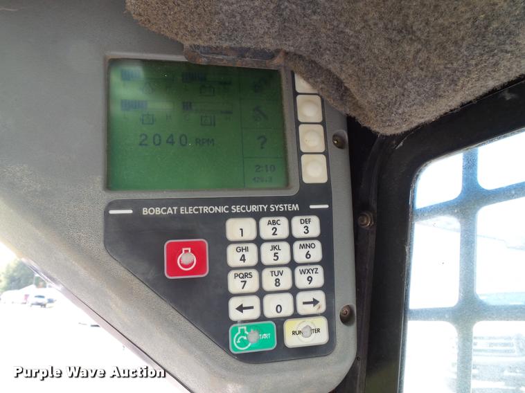 image for item K8131 2001 Bobcat 863 skid steer with backhoe attachment