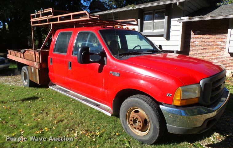 image for item L3274 1999 Ford F350 Super Duty Crew Cab flatbed pickup truck