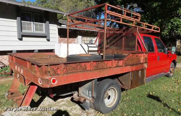 image for item L3274 1999 Ford F350 Super Duty Crew Cab flatbed pickup truck