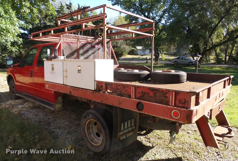 image for item L3274 1999 Ford F350 Super Duty Crew Cab flatbed pickup truck