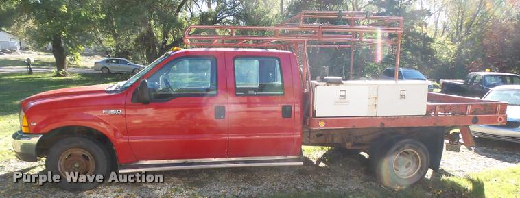 image for item L3274 1999 Ford F350 Super Duty Crew Cab flatbed pickup truck