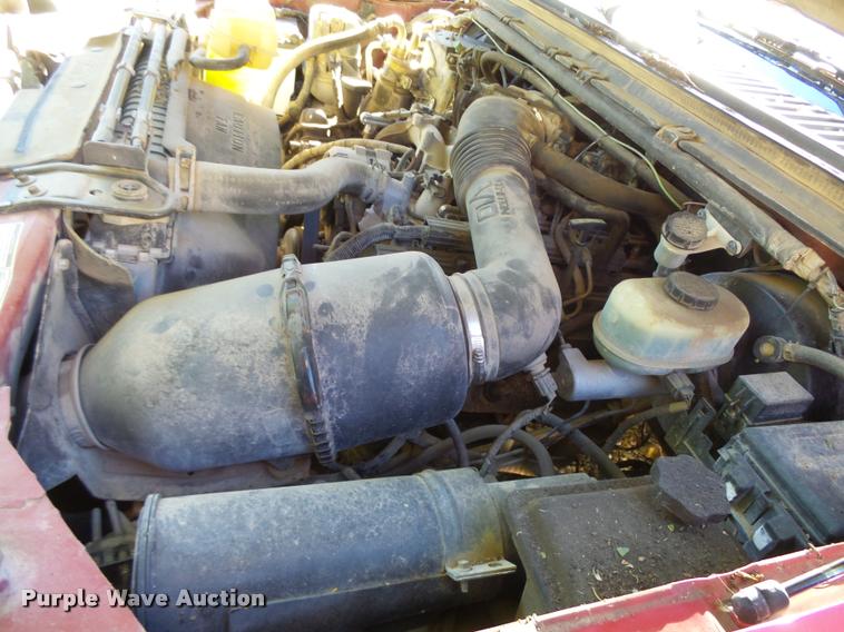 image for item L3274 1999 Ford F350 Super Duty Crew Cab flatbed pickup truck