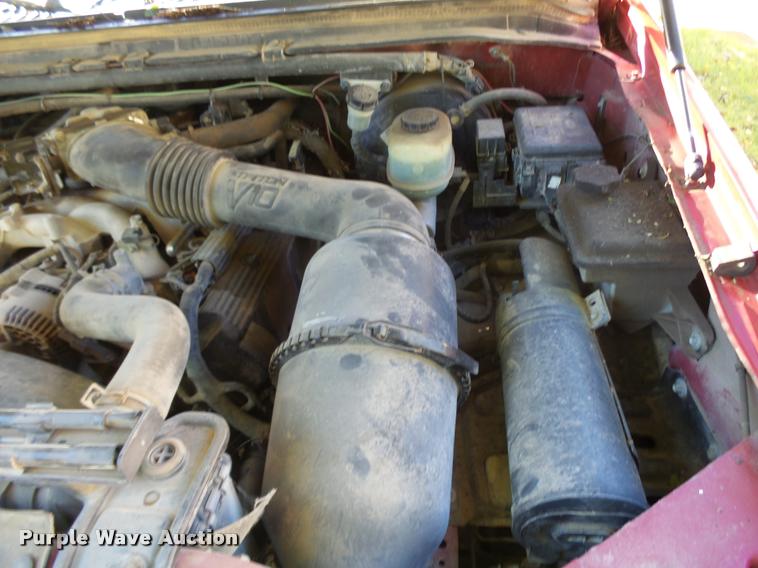 image for item L3274 1999 Ford F350 Super Duty Crew Cab flatbed pickup truck