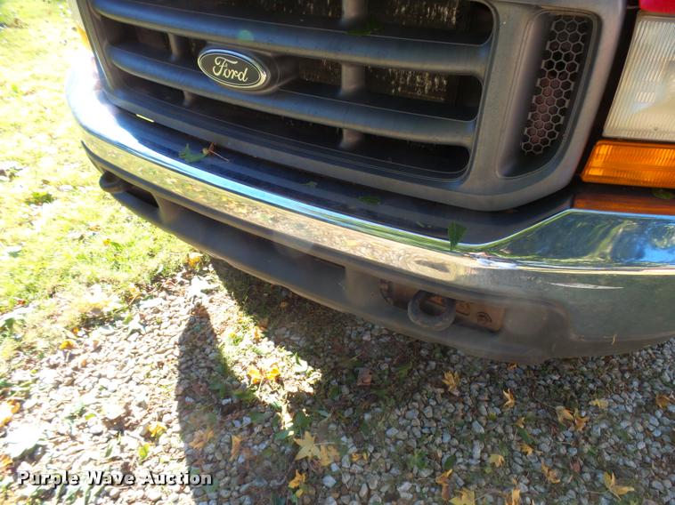 image for item L3274 1999 Ford F350 Super Duty Crew Cab flatbed pickup truck