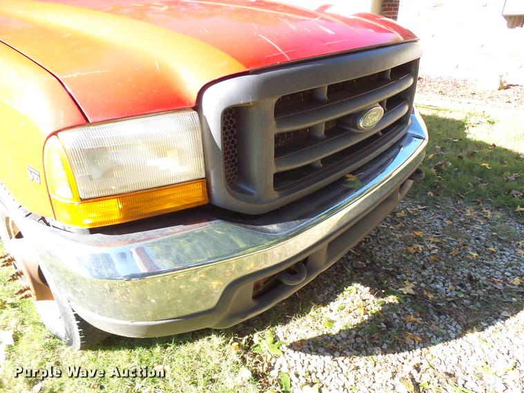 image for item L3274 1999 Ford F350 Super Duty Crew Cab flatbed pickup truck