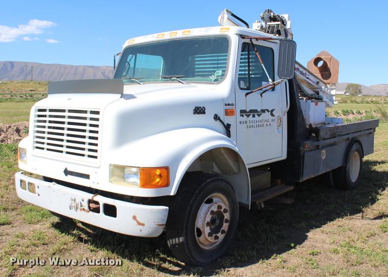 image for item K1916 1994 International 4700LP flatbed truck with environmental drill